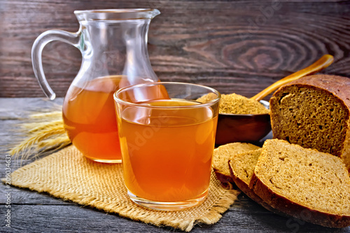 Kvass in glassware on dark board