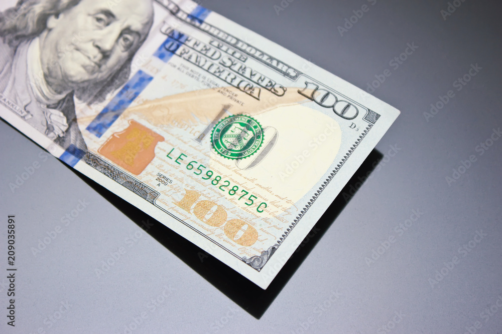 One hundred dollars banknotes isolated on black background One hundred dollars banknotes isolated on black background