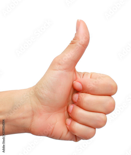 Closeup of female hand showing thumbs up sign isolated against  © alzay