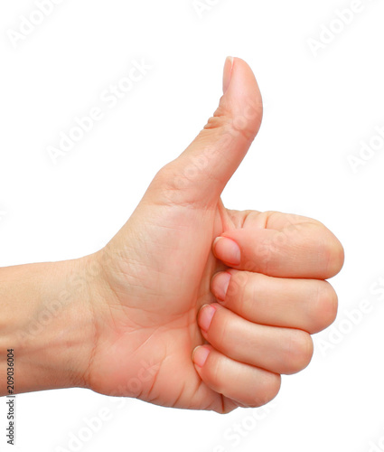 Closeup of female hand showing thumbs up sign isolated against 