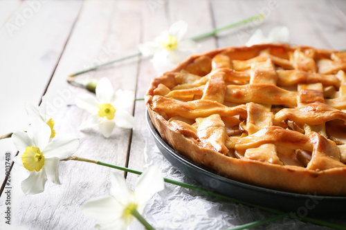 Tasty homemade apple pie on wooden table