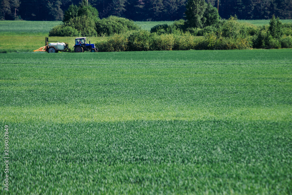 Tractor sprays water, pesticide treatment Tractor sprays water, pesticide treatment