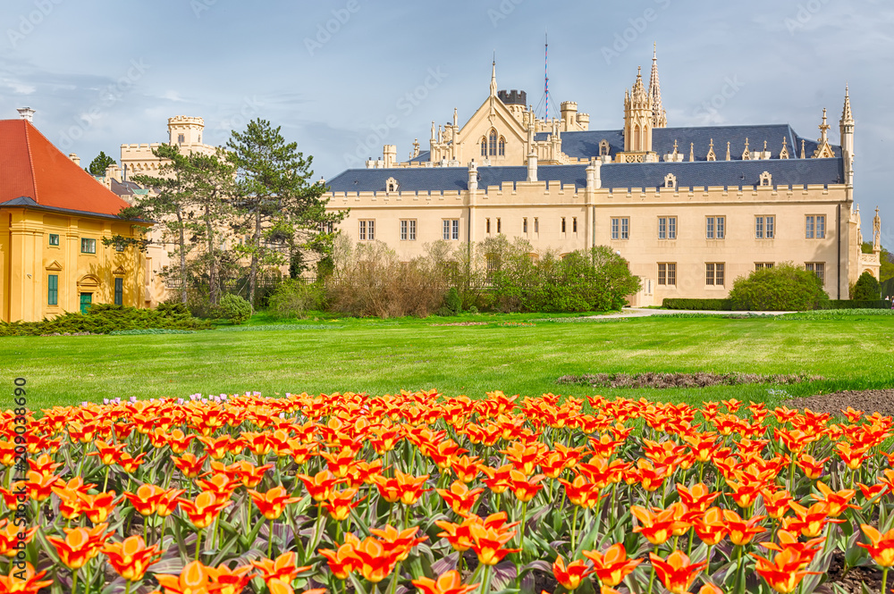 Castle Lednice with nice orange flowers in spring. UNESCO world heritage, Czech republic, South Moravia region.