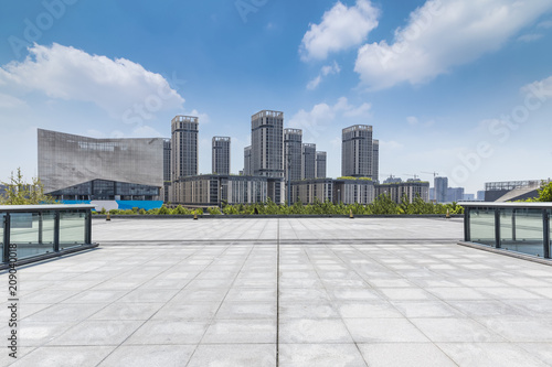 Panoramic skyline and modern business office buildings with empty road,empty concrete square floor