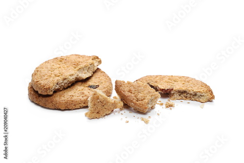 Round whole wheat biscuits with raisins isolated on white background