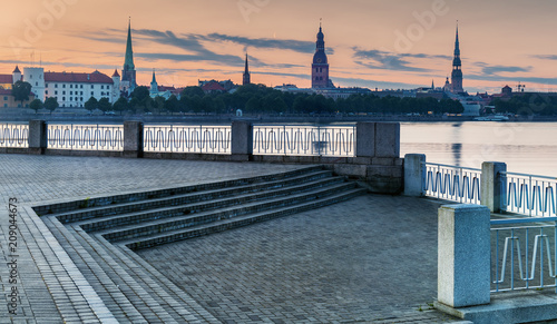 Embankment of Daugava river and medieval churches in historical center of old Riga city, Latvia