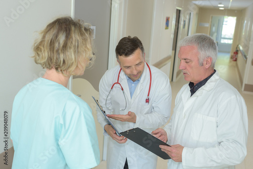 medical staffs conversation on the clipboard information