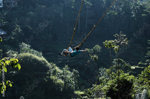 A man happily swing at Ubud Bali Indonesia