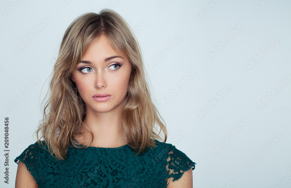 Beautiful young woman with blonde bob hairstyle on background with copy space Beautiful young woman with blonde bob hairstyle on background with copy space