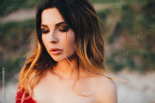 Outdoors portrait of beautiful young brunette woman. © galina_kovalenko