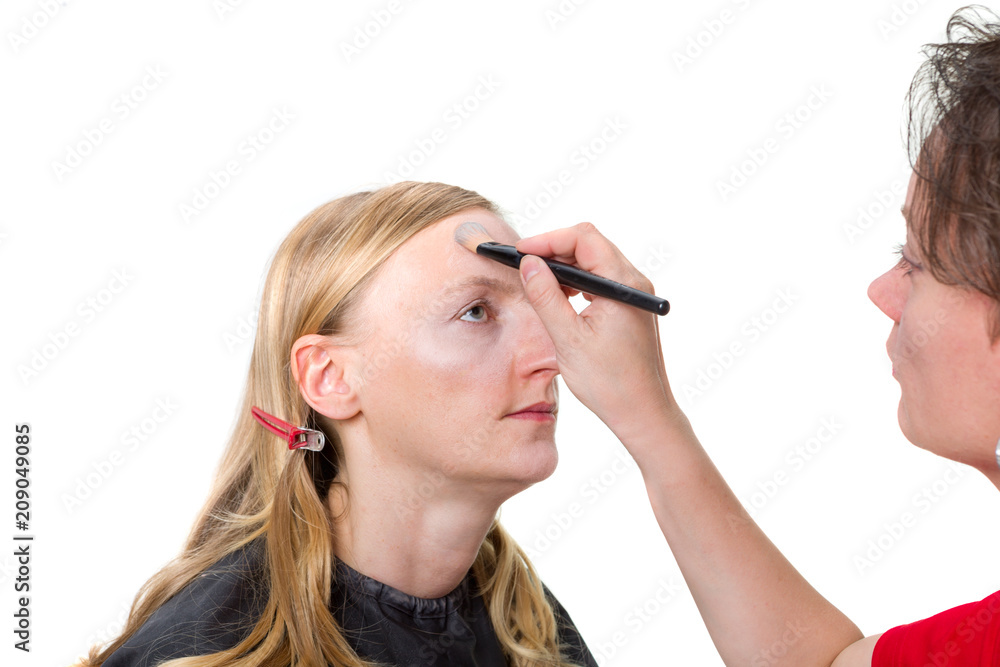 Closeup of a makeup artist applying makeup Closeup of a makeup artist applying makeup