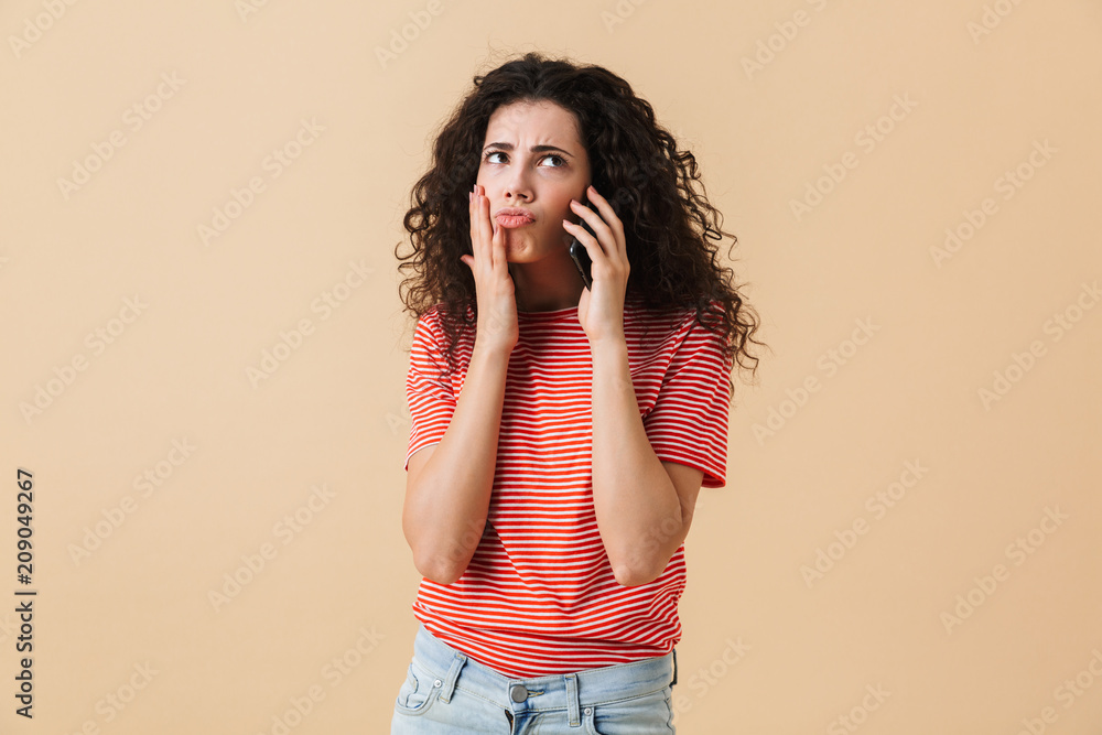 Portrait of a confused young girl with curly hair Portrait of a confused young girl with curly hair