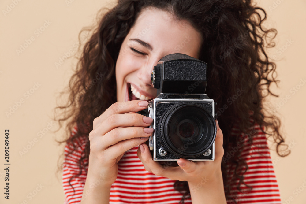 Pretty young curly woman photographer Pretty young curly woman photographer