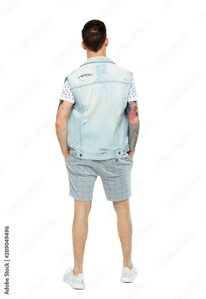 Fototapeta premium Back view of a stylish man in shorts.
