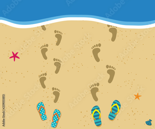 Honeymoon at the sea. Top view of loving couple footprints at sandy beach