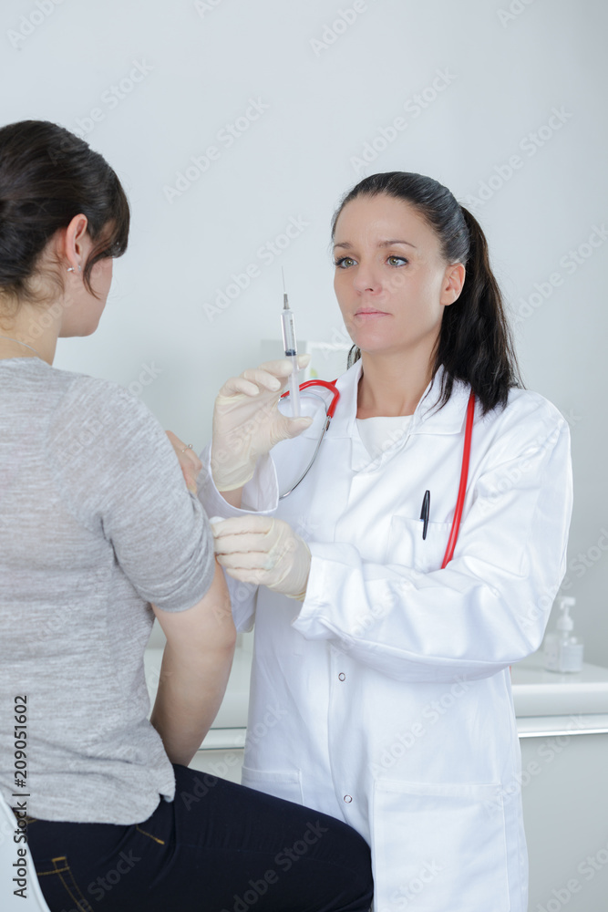 doctor injecting patients hand doctor injecting patients hand