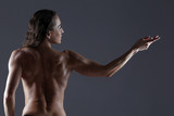 Bodybuilder woman showing her muscles.