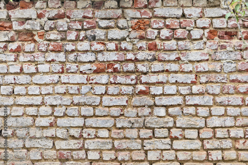 Fototapeta premium Dirty and grunge red brick wall from exterior