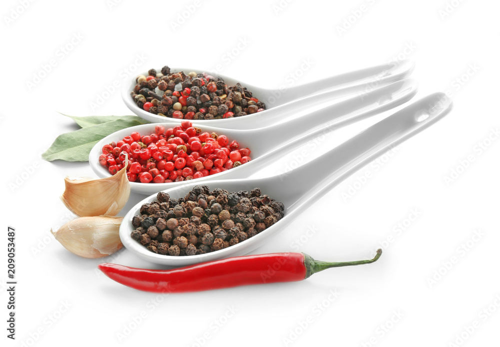 Spoons with various spices on white background Spoons with various spices on white background