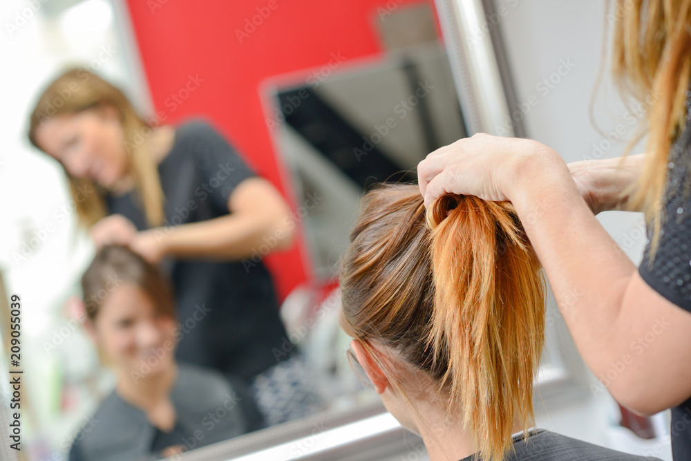 Having her hair styled Having her hair styled