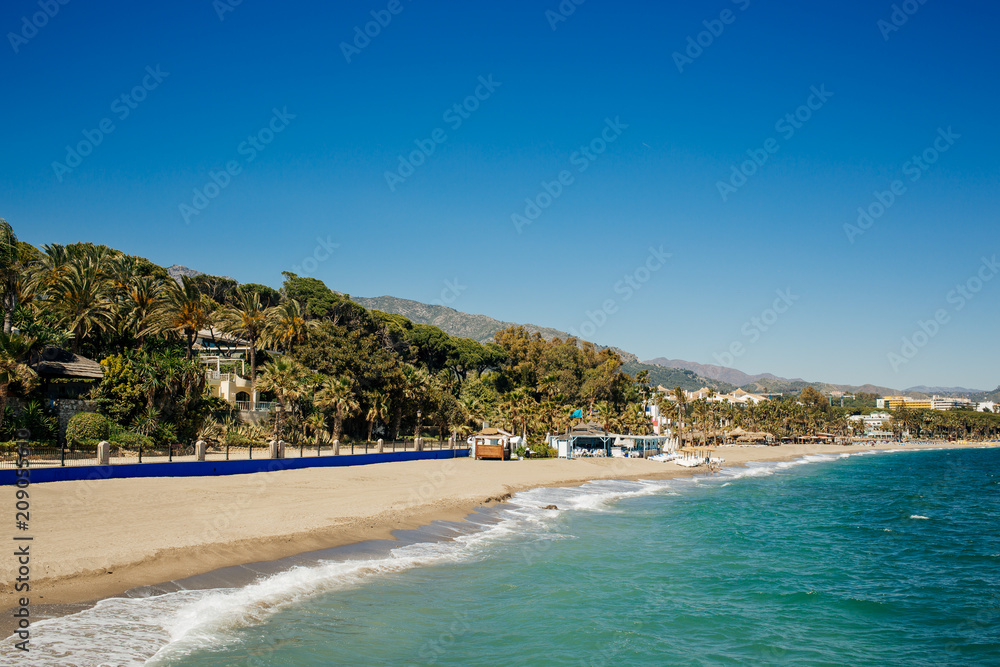 Beach next to The Golden Mile, promenade that joins Puerto Banús and Marbella. Beach next to The Golden Mile, promenade that joins Puerto Banús and Marbella.