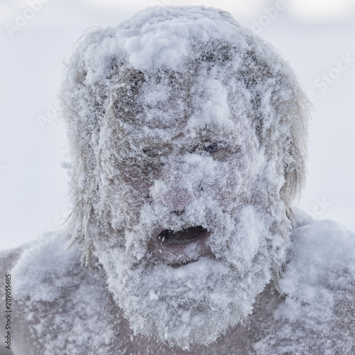 Portrait of a bearded man in the snow