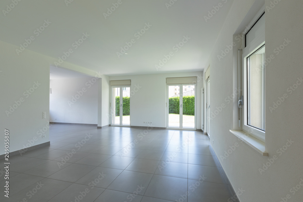Empty room with window and totally white walls Empty room with window and totally white walls