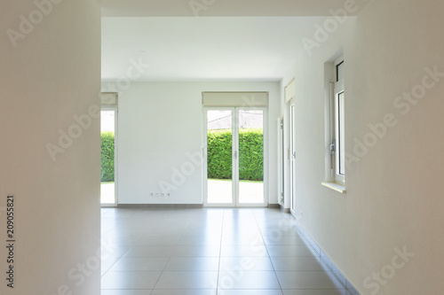 Empty room with window and totally white walls