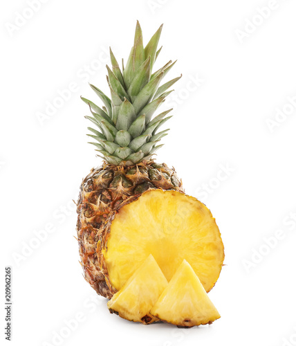 Delicious pineapple with slices on white background