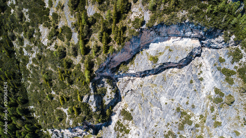 Aerial view of the large stone mountains in the Alps