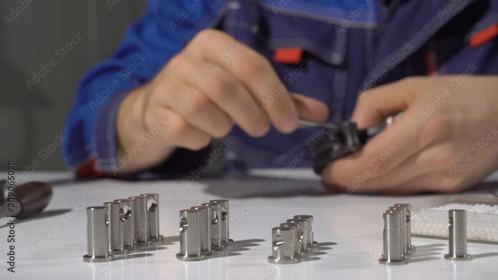A man makes yacht blocks. Factory for the production of equipment for sailing yachts. Production of yacht blocks for sails. Close up. 4K A man makes yacht blocks. Factory for the production of equipment for sailing yachts. Production of yacht blocks for sails. Close up. 4K