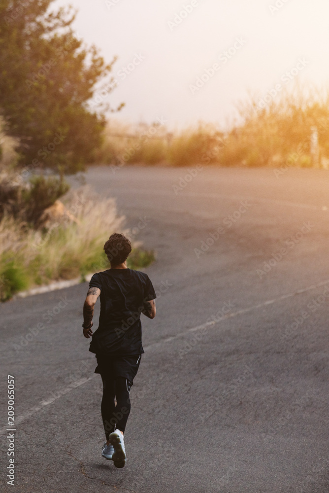 Fototapeta premium Athlete practicing outdoors for marathon