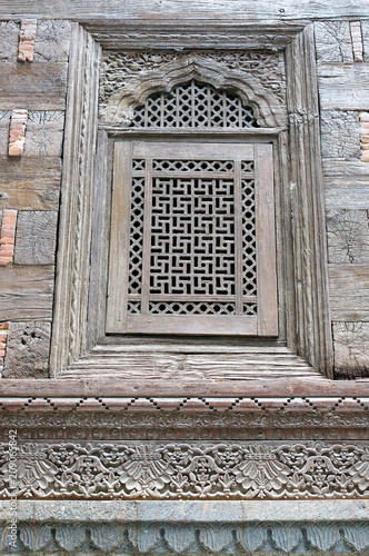 Detail wooden window with carving in mosque in Srinagar, Jammu and Kashmir, India photo