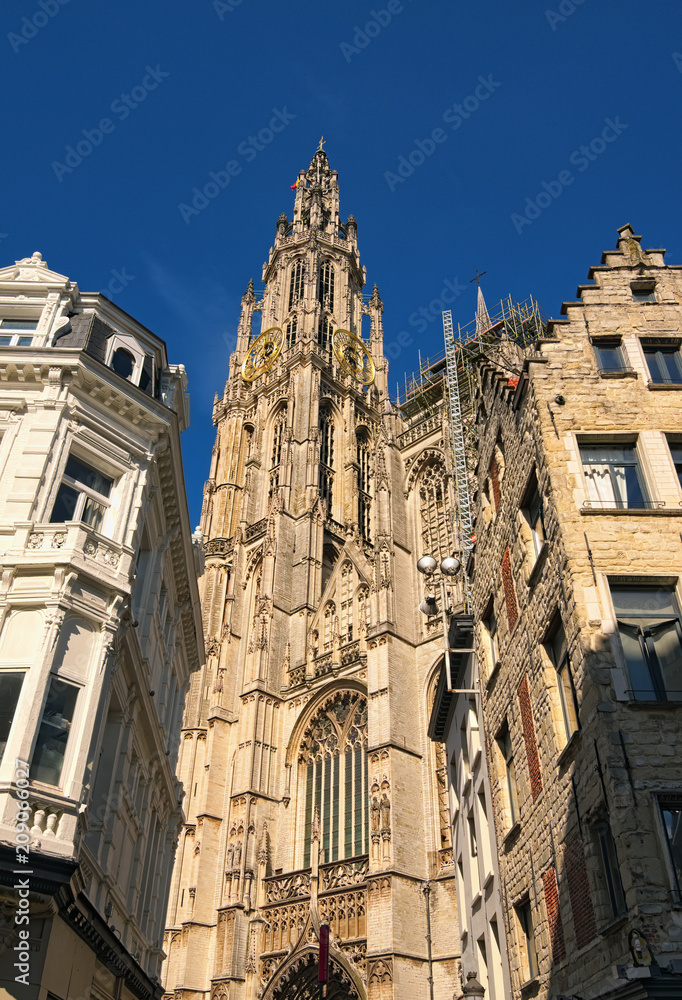 Obraz premium Amazing Bell tower with golden watch of the Cathedral of Our Lady. Tower is the highest in the Benelux