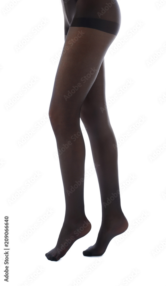Legs of beautiful young woman in tights on white background Legs of beautiful young woman in tights on white background