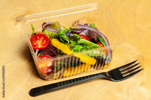 Vegetable salad in a plastic box. photo