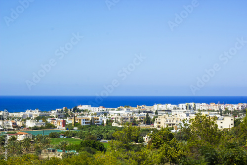Landscape of town Paphos and sea against blue sky, Cyprus