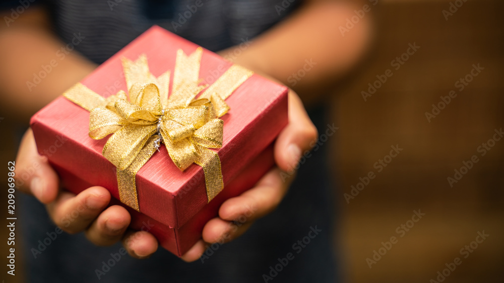 Little boy holding a gift box For birthday Little boy holding a gift box For birthday