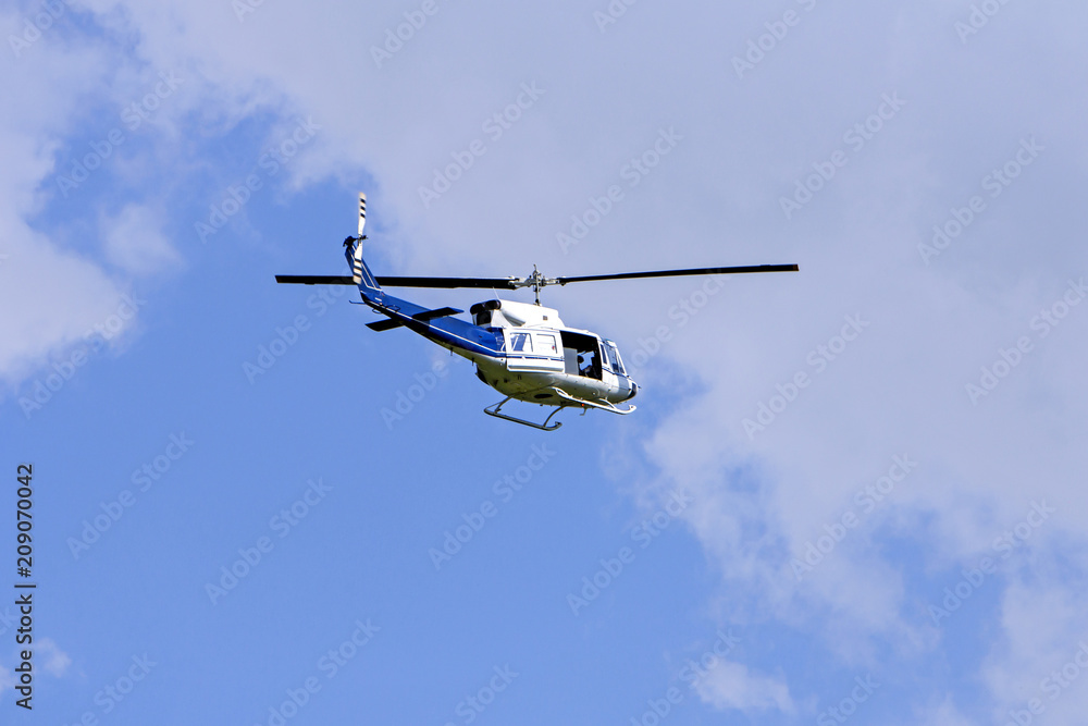 Blue helicopter flight in the sky Blue helicopter flight in the sky