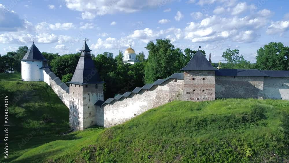 View of the towers of Pskov-Pechersk monastery, Sunny July day. Pechora, Russia View of the towers of Pskov-Pechersk monastery, Sunny July day. Pechora, Russia