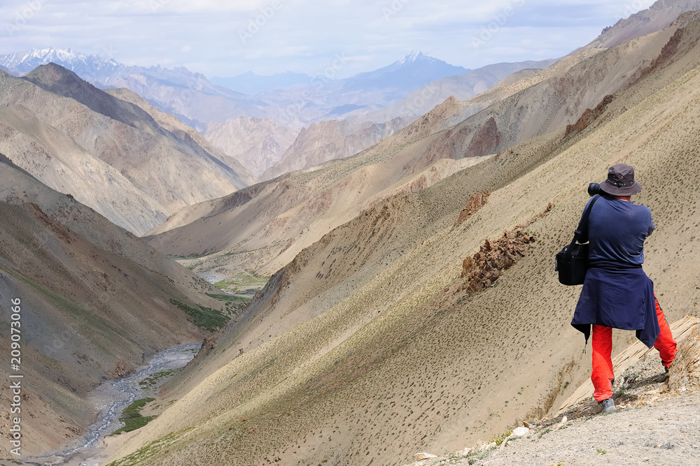 View on Konzke La pass, the tourist is taking the photograph during the trek in Ladakh.