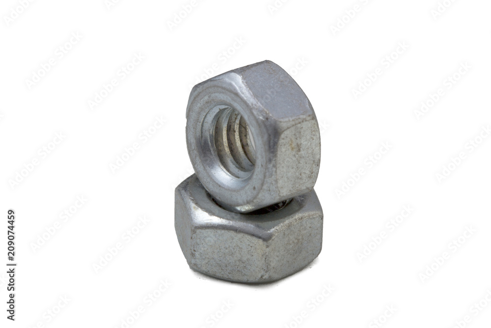 Close up pile of steel Hexagon Nuts or female nippers arranged isolated on white background. Close up pile of steel Hexagon Nuts or female nippers arranged isolated on white background.