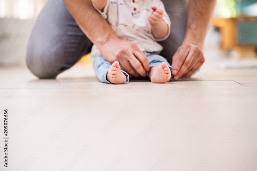 Unrecognizable father with a baby son at home. Copy space. Unrecognizable father with a baby son at home. Copy space.