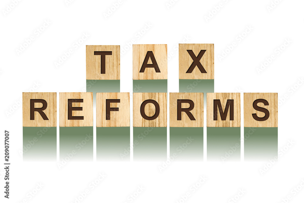 Word Tax Reforms, composed of letters on wooden construction cubes. White background, isolated Concept business, finance. Word Tax Reforms, composed of letters on wooden construction cubes. White background, isolated Concept business, finance.