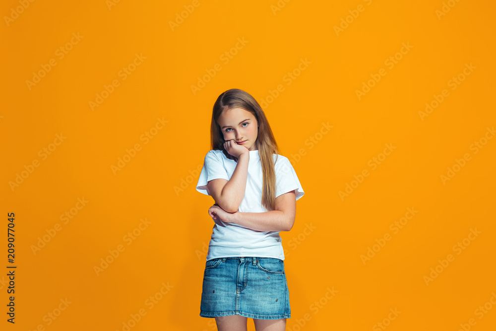 Young serious thoughtful teen girl. Doubt concept. Young serious thoughtful teen girl. Doubt concept.