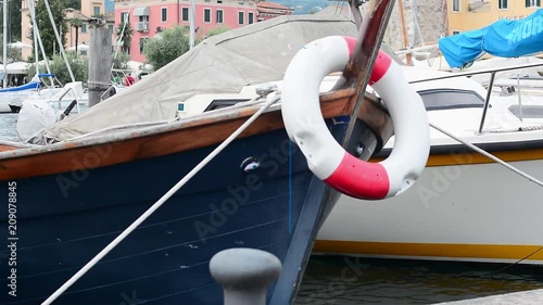 A small motor boat moored at the port.