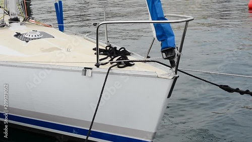 A small motor boat moored at the port.