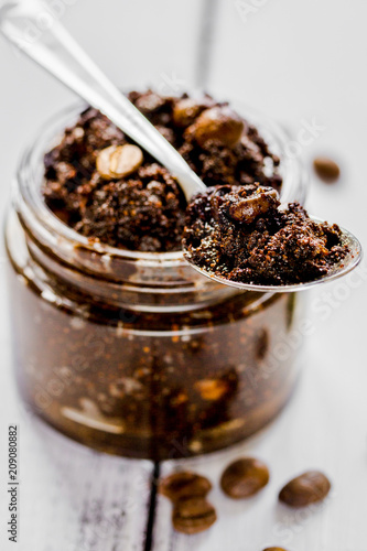 Organic scrub from ground coffee on wooden table background
