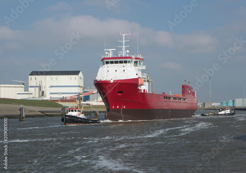 Freightship with towboat. Netherlands. Harbor. Coaster photo