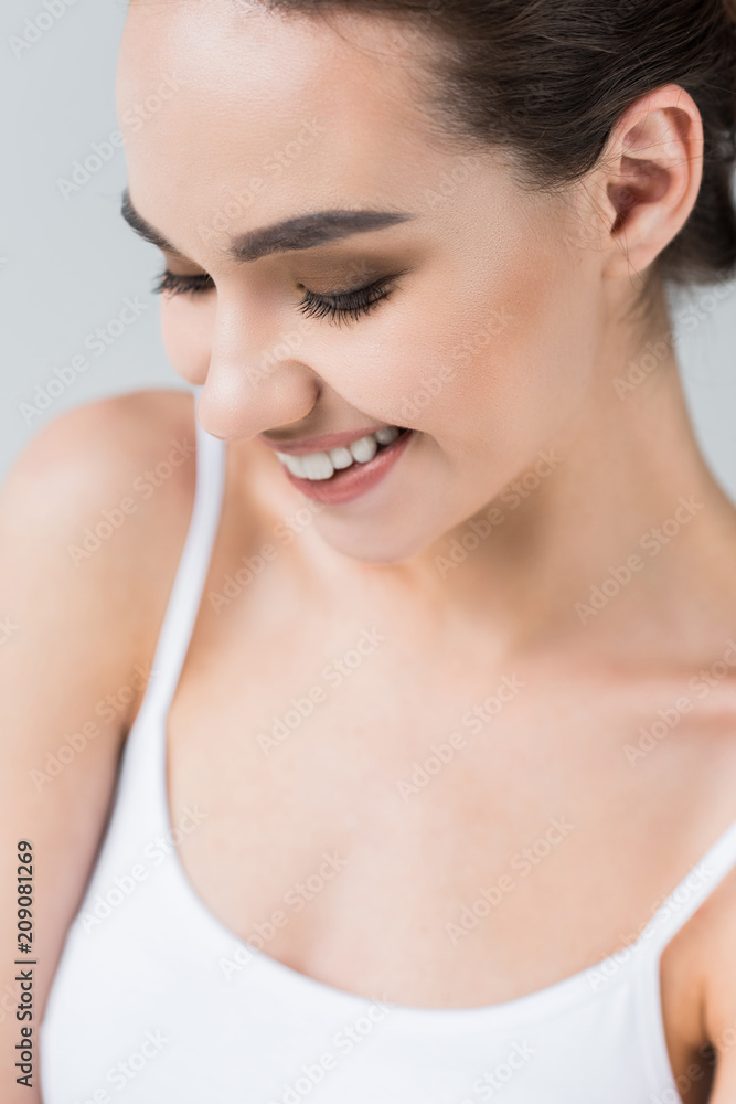 smiling attractive caucasian woman isolated on gray background smiling attractive caucasian woman isolated on gray background